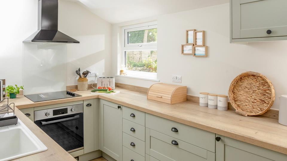 Modern fully-equipped kitchen at Ealing House holiday cottage Porthleven
